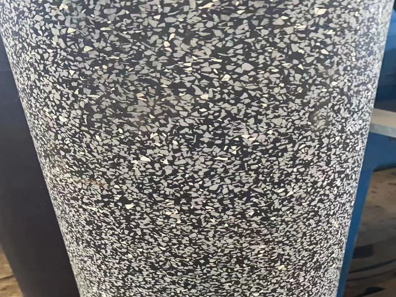 A cross-section illustration of an acoustic flooring system with multiple layers